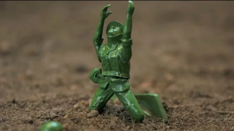 Photo from <a href='https://www.theatlantic.com/video/index/262628/little-plastic-green-army-men-invade-a-garden-chaos-ensues/'>this amazing video</a>.